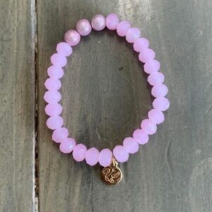 Victoria Lynn pale 10 MM pale pink/rose gold Glass Beads Stretch Bracelet.